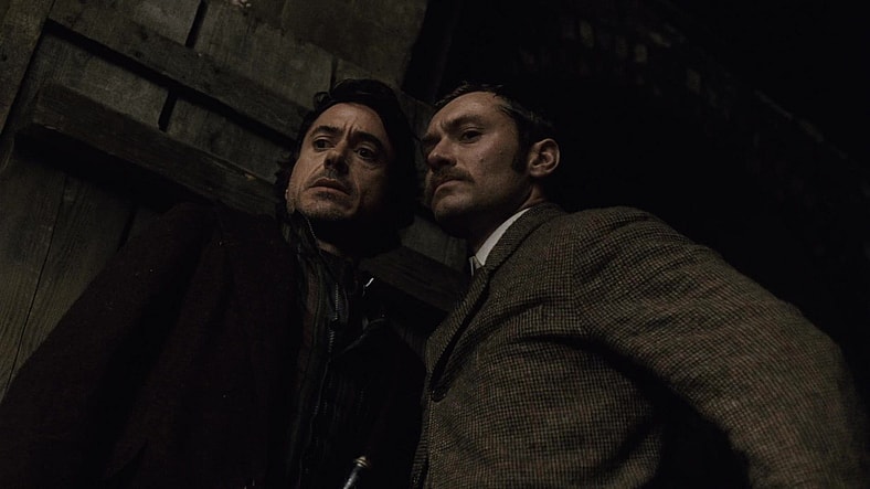 Holmes (Robert Downey Jr.) and Watson (Jude Law) thwart Lord Blackwood's (Mark Strong) occult murder plot in Sherlock Holmes (2009), Warner Bros. Pictures