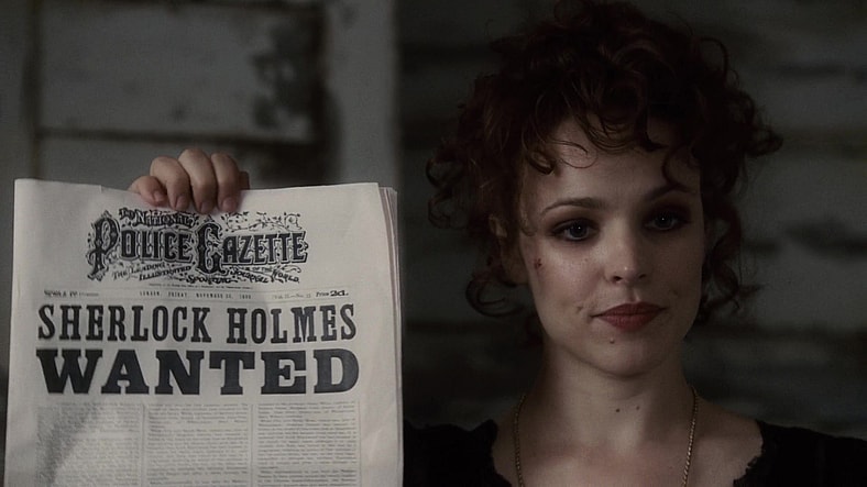 Irene Adler (Rachel McAdams) is less than amused with Holmes' (Robert Downey Jr.) public shenanigans in Sherlock Holmes (2009), Warner Bros. Pictures