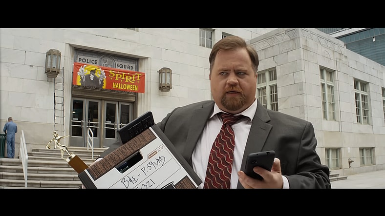 Ed Hocken Jr. (Paul Walter Hauser) leaves Police Squad in The Naked Gun (2025), Paramount Pictures