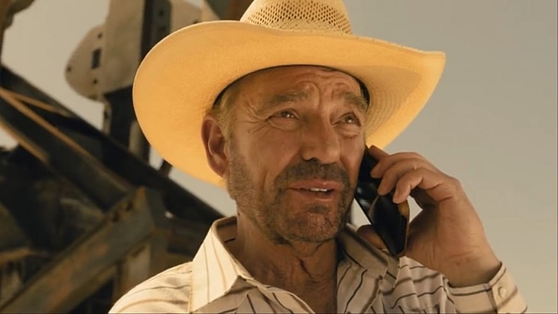 Tommy Norris (Billy Bob Thornton) receives Angela's (Q'orianka Kilcher) call in Landman Season 1 Episode 5 "You Owe Me A Lot Of Money" (2024), Paramount Network