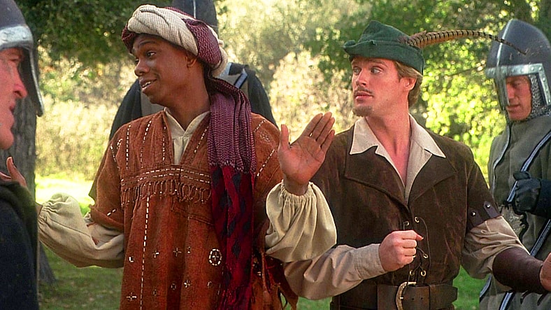 Robin (Cary Elwes) and Achoo (Dave Chappelle) find themselves surrounded by Prince John's (Richard Lewis) men in Robin Hood: Men in Tights (1993), Brooksfilms