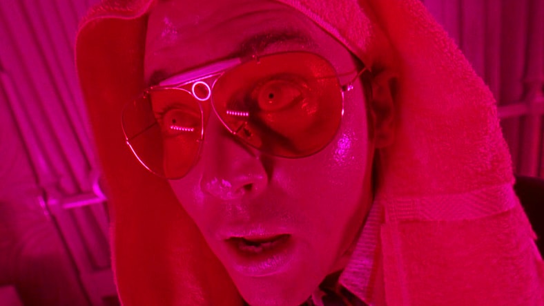 Raoul Duke (Johnny Depp) begins to freak out after taking a dropper of adrenochrome in Fear and Loathing in Las Vegas (1998), Universal Pictures