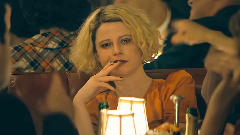 Ida (Jessie Buckley) takes a drag of a cigarette on what will be the last night of her life in The Bride! (2026), Warner Bros. Pictures
