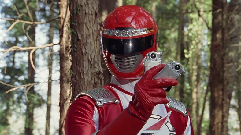 Bouken Red (Mitsuomi Takahashi) returns Souta (Masahi Mikami) and Natsuki's (Chise Nakamura) Accelulars in GoGo Sentai Bokenger Episode 12 "The Pipes of Hamelin" (2006), Toei Co. Ltd.