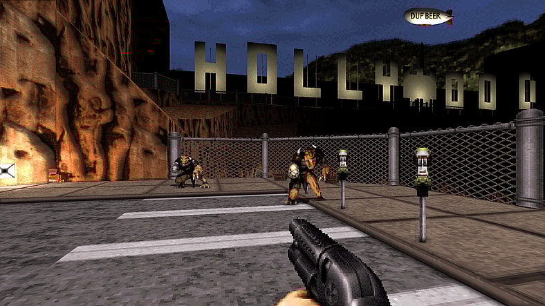 Duke Nukem (Jon St. John) fights aliens in front of the Hollywood sign in Duke Nukem 3D: 20th Anniversary Edition World Tour (2016), Gearbox Publishing