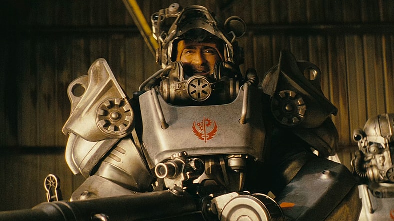 Maximus (Aaron Moten) urges Xander (Kumail Nanjiani) not to mow down a group of unarmed ghoul children in Fallout Season 2 Episode 3 "The Prolifigate" (2026), Amazon