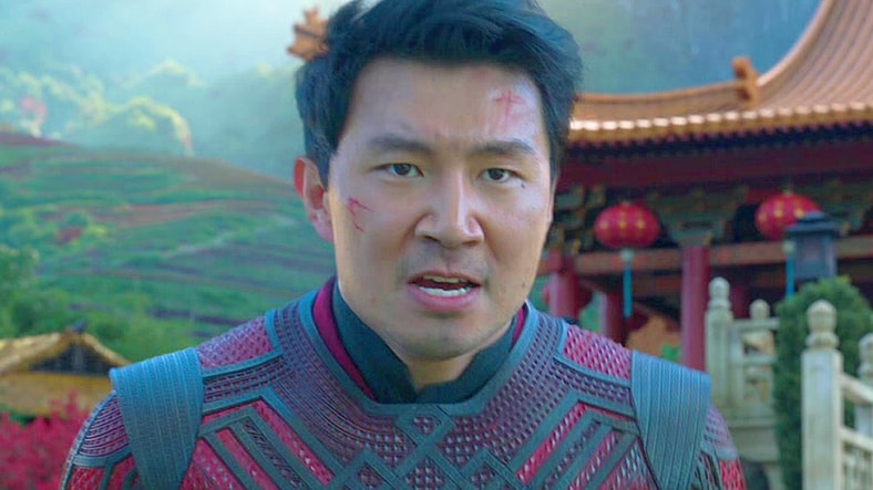 Shang-Chi (Simu Liu) stands in defense of Tao Lo against Wenwu (Tony Leung) in Shang-Chi and the Legend of the Ten Rings (2021), Marvel Entertainment