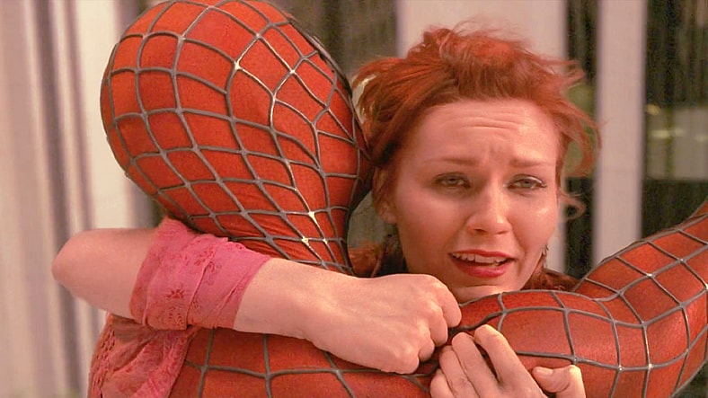 Spider-Man (Tobey Maguire) swings in to save Mary-Jane Watson (Kirsten Dunst) from going splat in Spider-Man (2002), Sony