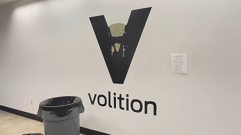 Volition's logo being torn off the wall of their office in My 2019 Visit to Volition & the Saints Row We Never Got (Part 1) (2025), YouTube
