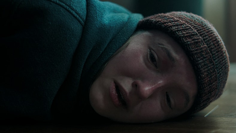 Ellie (Bella Ramsey) watches on powerless as Joel (Pedro Pascal) succumbs to his wounds in The Last of Us Season 2 Episode 2 "Through the Valley" (2025), HBO