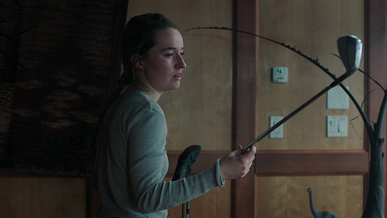 Abby (Kaitlyn Dever) decides upon her weapon of choice in The Last of Us Season 2 Episode 2 "Through the Valley" (2025), HBO