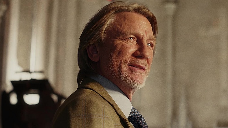 Benoit Blanc (Daniel Craig) makes his first visit to the site of Msgr. Wicks' (Josh Brolin) murder in Wake Up Dead Man: A Knives Out Mystery (2025), Netflix