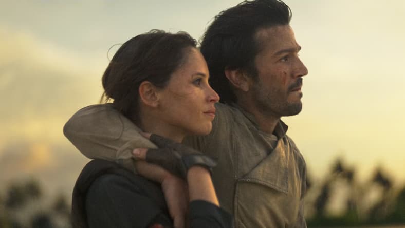 Jyn Erso(Felicity Jones) and Cassian Andor (Diego Luna) complete their mission in Rogue One: A Star Wars Story (2016), Lucasfilm