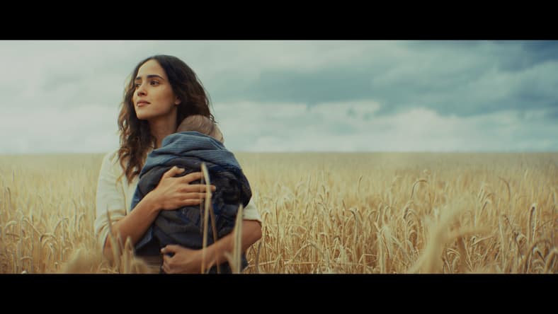 Bix Caleen (Adria Arjona) holds her newborn child in Andor Season 2 Episode 12 "Jedha, Kyber, Erso" (2025), Lucasfilm