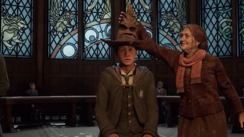 Deputy Headmistress Professor Matilda Weasley places the Sorting Hat on the player character's head via Hogwarts Legacy (2022), Warner Bros. Interactive Entertainment