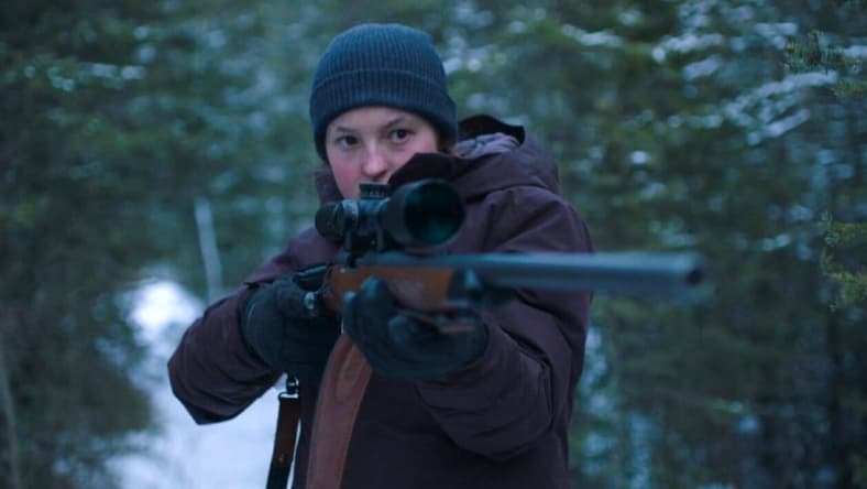 Bella with a gun