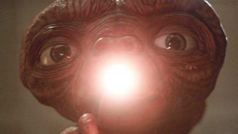 E.T. (Pat Welsh/Steven Spielberg/Kayden Green) opens up his heart in E.T. the Extra-Terrestrial (1982), Universal Pictures