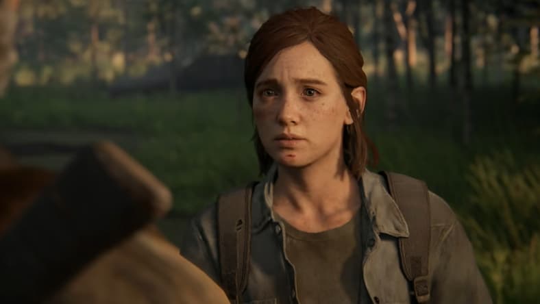 Ellie (Ashley Johnson) looks on sadly at Joel Miller (Troy Baker) in The Last of Us Part II (2020), Sony Interactive Entertainment