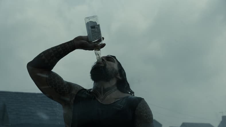 Arthur Curry (Jason Momoa) drinking in Zack Snyder's Justice League (2021), Warner Bros. Pictures