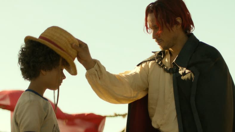 One Piece. (L to R) Colton Osorio as Young Luffy, Peter Gadiot as Shanks in season 1 of One Piece. Cr. Courtesy of Netflix © 2023