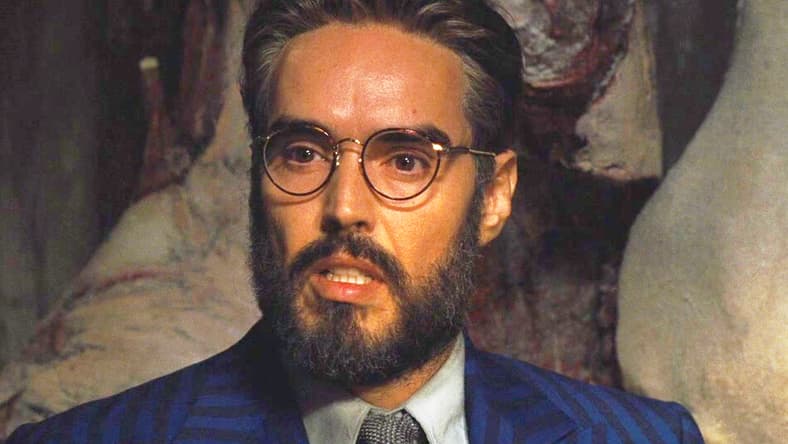 Dr. Windlesham (Russell Brand) faces interrogation in Death on the Nile (2022), 20th Century Studios