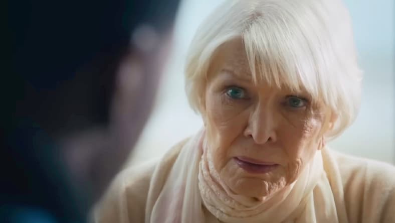 Chris MacNeil (Ellen Burstyn) opines to Victor Fielding (Leslie Odom Jr.) about why she was not allowed to see Regan's (Linda Blair) exorcism in The Exorcist: Believer (2023), Universal Pictures