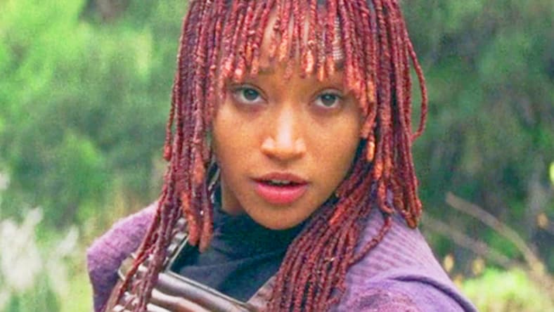 Mae (Amandla Stenberg) is reluctant to heed Qimir's (Danny Jacinto) travel advice in The Acolyte Season 1 Episode 4 'Day' (2024), Disney