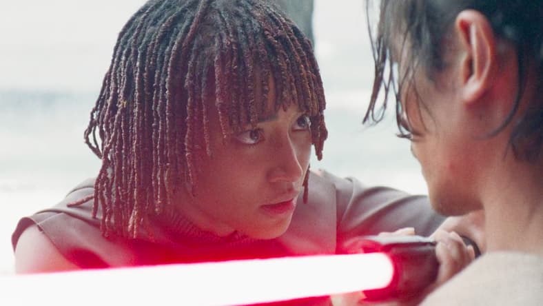 Osha (Amandla Stenberg) brings Qimir's (Manny Jacinto) lightsaber to his own throat in The Acolyte Season 1 Episode 6 'Teach/Corrupt' (2024), Disney