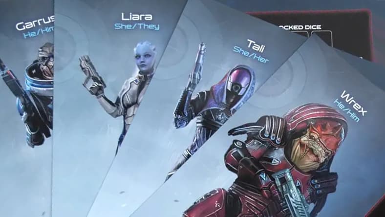 The character sheets for Wrex, Tali, Liara, and Garrus in Mass Effect: The Board Game – Priority Hagalaz set (2024), Modiphius