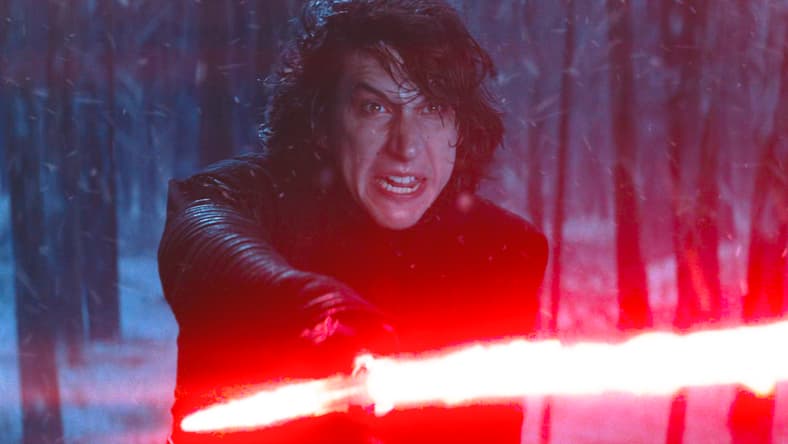 Kylo Ren (Adam Driver) draws his light saber in Star Wars Episode VII - The Force Awakens (2015), Lucasfilm
