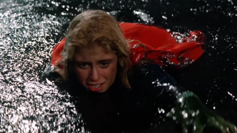 Mud wrestling is not Kara's (Helen Slater) forte in Supergirl (1984), Warner Bros. Pictures