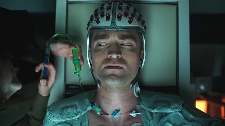Mickey (Robert Pattinson) wears his special helmet for his shots in Mickey 17 (2025), Warner Bros. Pictures
