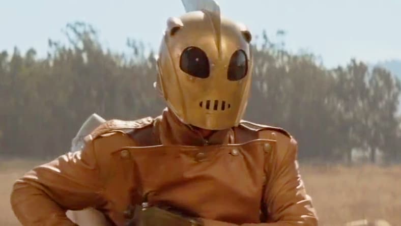 Cliff (Billy Campbell) asks Peevy (Alan Arkin) to wish him luck in The Rocketeer (1991), Walt Disney Pictures