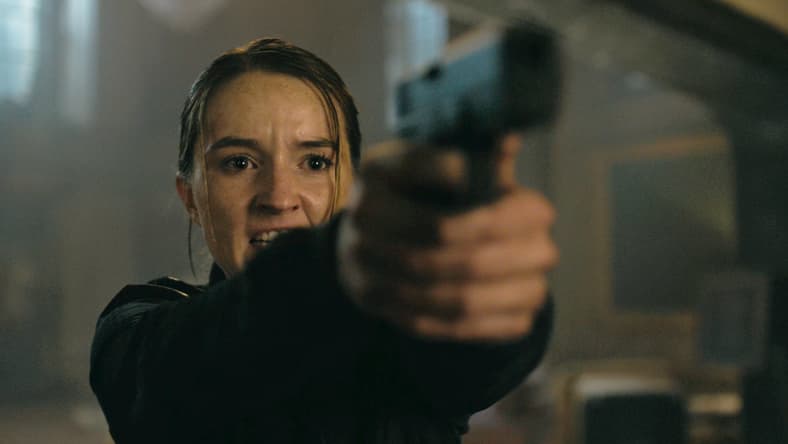 Abby (Kaitlyn Dever) puts Ellie (Bella Ramsey) in her sights in The Last of Us Season 2 Episode 7 "Convergence" (2025), HBO