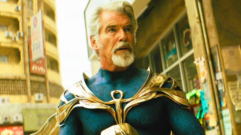Doctor Fate (Pierce Brosnan) rethinks his battle strategy against Teth-Adam (Dwayne Johnson) in Black Adam (2022), Warner Bros. Pictures