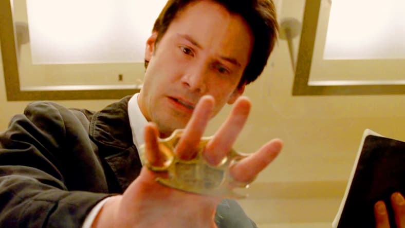 John Constantine (Keanu Reeves) gives Balthazar (Gavin Rossdale) his last rites in Constantine (2005), Warner Bros. Pictures