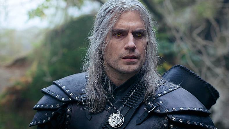 Confused Geralt (Henry Cavill) questions Jaskier (Joey Batey) in The Witcher (2021), Netflix