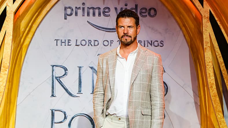 Lloyd Owen On 'The Lord Of The Rings: The Rings Of Power' Season 2: "Everyone Is Going To Be Faced