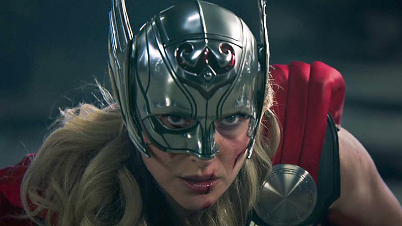 Jane Foster (Natalie Portman) swings at Gorr (Christian Bale) in Thor: Love and Thunder (2022)
