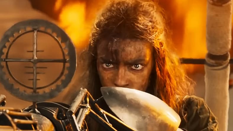 Furiosa takes aim with a harpoon gun in Furiosa: A Mad Max Saga (2024)