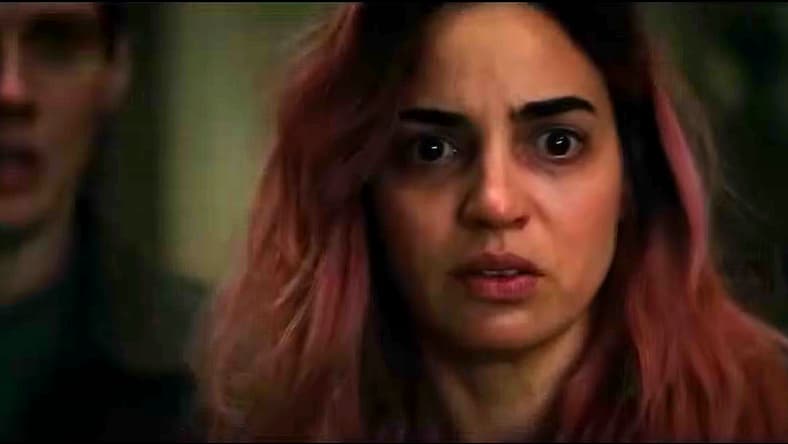 A Deadite raises a glass to Souheila Yacoub and family in Evil Dead Burn (2026), Warner Bros. Pictures