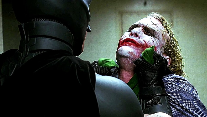 Batman (Christian Bale) doesn’t clown around with Joker (Heath Ledger) in The Dark Knight (2008), Warner Bros. Pictures