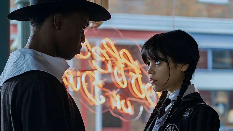 Wednesday. (L to R) Iman Marson as Lucas Walker, Jenna Ortega as Wednesday Addams in episode 101 of Wednesday. Cr. Vlad Cioplea/Netflix © 2022