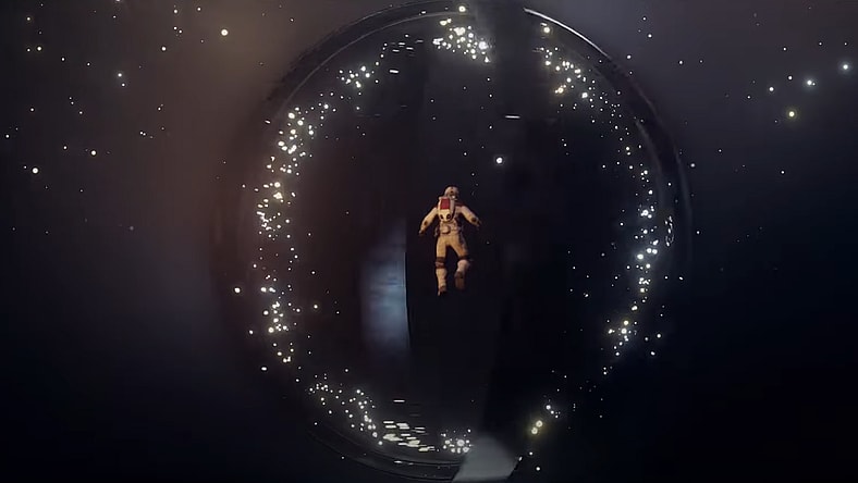 An astronaut floats before a whirling alien artifact made of rings via Starfield: Official Launch Date Announcement, Bethesda Softworks YouTube