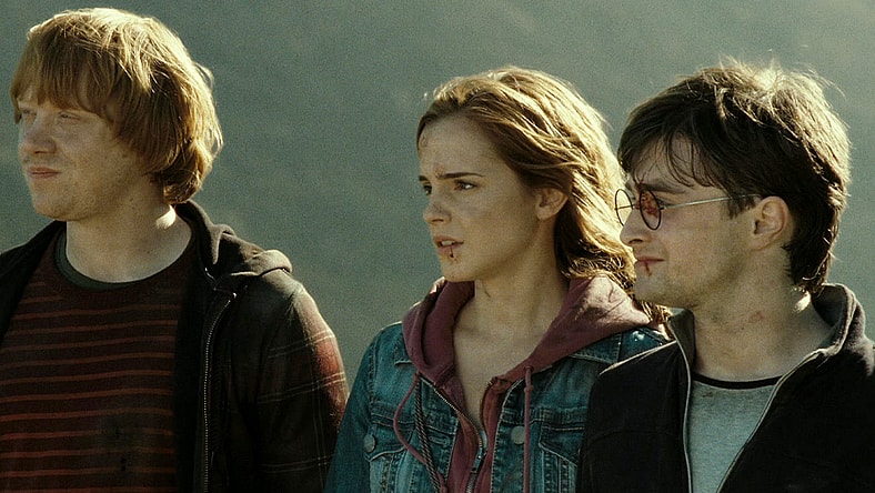 Ron Weasley (Rubert Gint), Hermoine Granger (Emma Watson), and Harry Potter (Daniel Radcliffe) look out to the future in the final scene of Harry Potter and the Deathly Hallows - Part 2 (2010), Warner Bros. Pictures