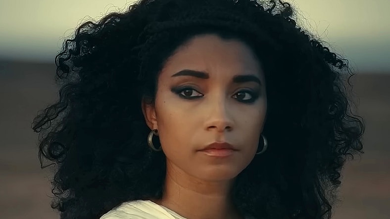 Cleopatra (Adele James) looks out upon the sands in Queen Cleopatra (2023), Netflix