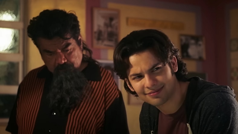 George Lopez as Uncle Rudy and Xolo Maridueña as Jaime Reyes in Blue Beetle (2023), DC Studios