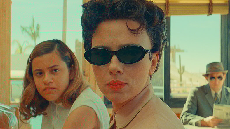 (L to R) Grace Edwards as "Dinah", Scarlett Johansson as "Midge Campbell" and Damien Bonnaro as "Bodyguard/Driver" in writer/director Wes Anderson's ASTEROID CITY, a Focus Features release. Credit: Courtesy of Pop. 87 Productions/Focus Features