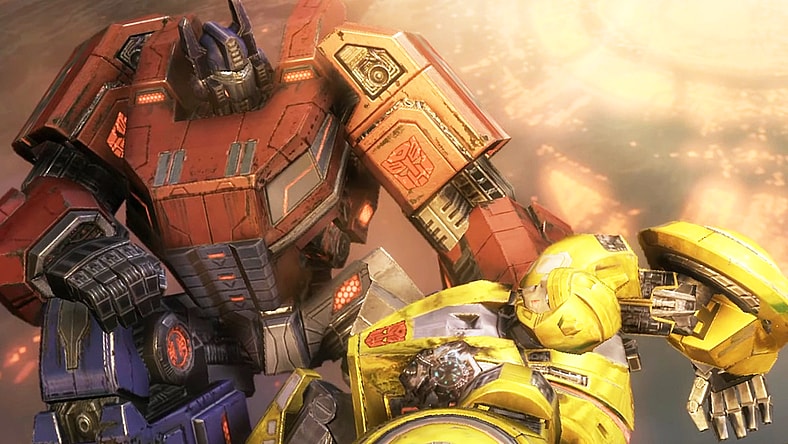 Optimus Prime (Peter Cullen) tends to a wounded Bumblebee (Johnny Young Bosch) in Transformers: War for Cybertron (2010), Activision