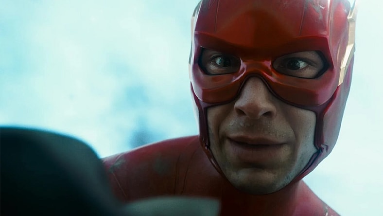 The Flash (Ezra Miller) holds a dying Batman (Michael Keaton) in The Flash (2023), Warner Bros. Pictures